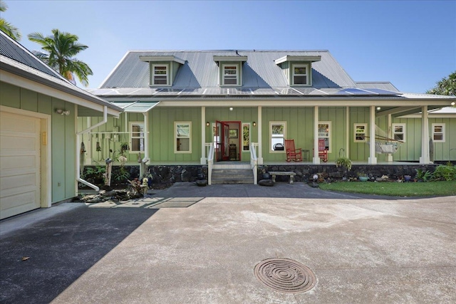82-5957 Wakida Dr, Captain Cook, HI 96704 - view of front facade featuring board and batten siding and a porch