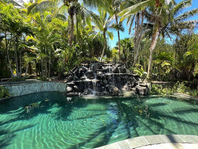 5-2841 Kuhio Hwy Unit A, Kilauea, HI 96754 - outdoor pool featuring a garden pond