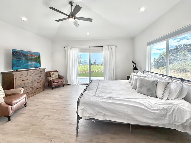 94-5774 Kalakau St, Naalehu, HI 96772 - bedroom with lofted ceiling, access to outside, multiple windows, light wood finished floors, and recessed lighting