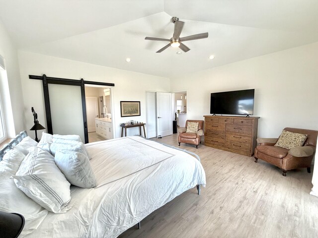 94-5774 Kalakau St, Naalehu, HI 96772 - bedroom with a barn door, light wood-style floors, vaulted ceiling, recessed lighting, and ceiling fan