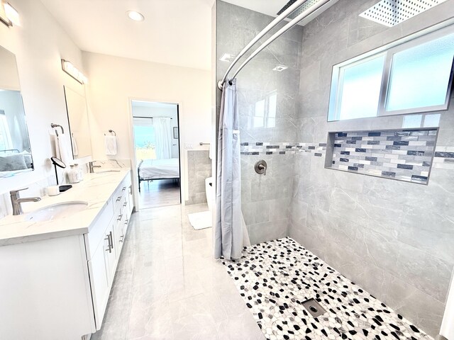 94-5774 Kalakau St, Naalehu, HI 96772 - ensuite bathroom with a tile shower, plenty of natural light, double vanity, and recessed lighting