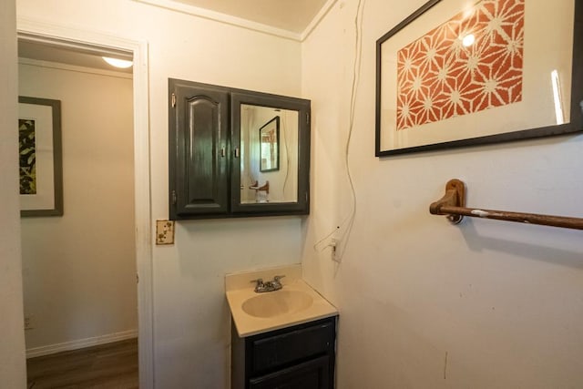 15-2024 19th Ave, Keaau, HI 96749 - bathroom with vanity, wood finished floors, and baseboards