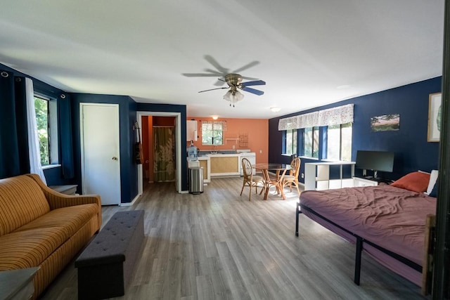 15-2024 19th Ave, Keaau, HI 96749 - living room featuring wood finished floors, ceiling fan, and washer / clothes dryer