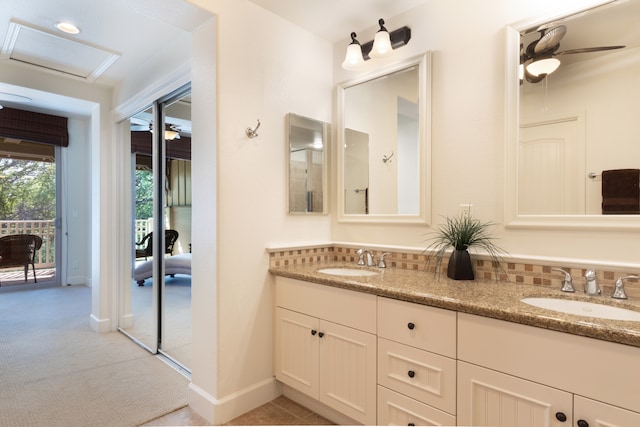 68-1118 Kaniku Dr Unit 404, Kamuela, HI 96743 - bathroom featuring double vanity, baseboards, and ceiling fan