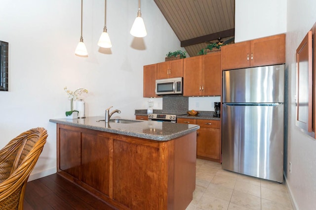 78-7039 Kamehameha Iii Rd Unit 25, Kailua-Kona, HI 96740 - kitchen featuring appliances with stainless steel finishes, a sink, brown cabinetry, high vaulted ceiling, and dark stone counters