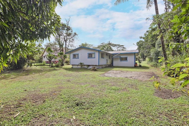 15-2737 Lai St, Pahoa, HI 96778 - rear view of house featuring a yard and metal roof