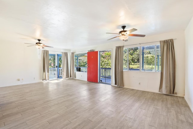 15-2737 Lai St, Pahoa, HI 96778 - unfurnished living room featuring ceiling fan, light wood-style flooring, and baseboards
