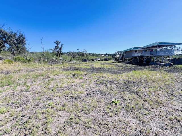 92-8685 Paradise Pkwy, Ocean View, HI 96737 - view of yard with a deck, stairway, and a rural view