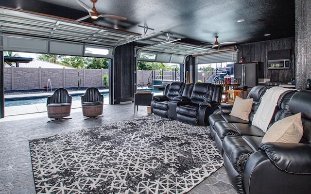 15-1462 13th Ave, Keaau, HI 96749 - living area with a ceiling fan and plenty of natural light
