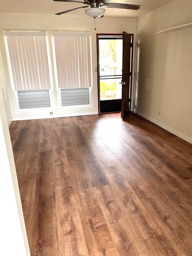 4461 Kamoa Rd Unit D12, Kapaa, HI 96746 - spare room featuring a ceiling fan, wood finished floors, and baseboards