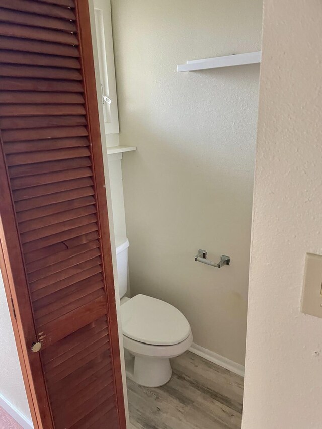 4461 Kamoa Rd Unit D12, Kapaa, HI 96746 - bathroom with wood finished floors, toilet, and baseboards