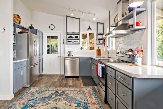 87-3210 Guava Rd, Captain Cook, HI 96704 - kitchen with stainless steel appliances, gray cabinetry, dark wood-style flooring, and open shelves