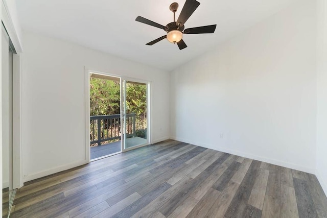 87-3210 Guava Rd, Captain Cook, HI 96704 - spare room featuring wood finished floors, vaulted ceiling, a ceiling fan, and baseboards