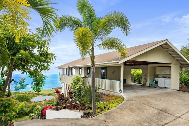 87-3210 Guava Rd, Captain Cook, HI 96704 - single story home featuring washer / dryer, concrete driveway, a porch, and a carport
