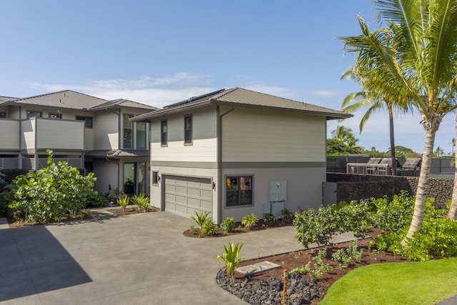 73-4780 Hinahina Rd Unit 24, Kailua-Kona, HI 96740 - view of front of home featuring driveway, a garage, and stucco siding