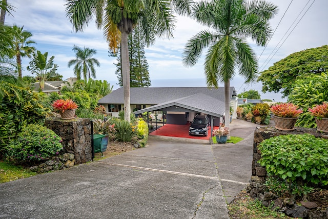 78-6928 Walua Rd, Kailua-Kona, HI 96740 - view of front of home featuring concrete driveway, roof with shingles, and a carport
