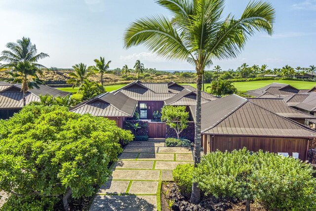 73-6250 Alani Loop Unit 12, Kailua-Kona, HI 96740 - view of front of house with a standing seam roof, metal roof, and board and batten siding