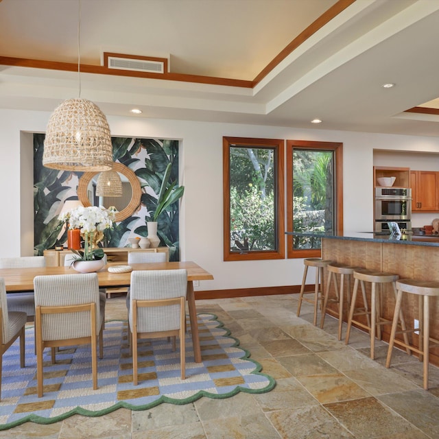 81-6641 Auamo Pl, Kealakekua, HI 96750 - dining area featuring baseboards, recessed lighting, a tray ceiling, and stone finish floors