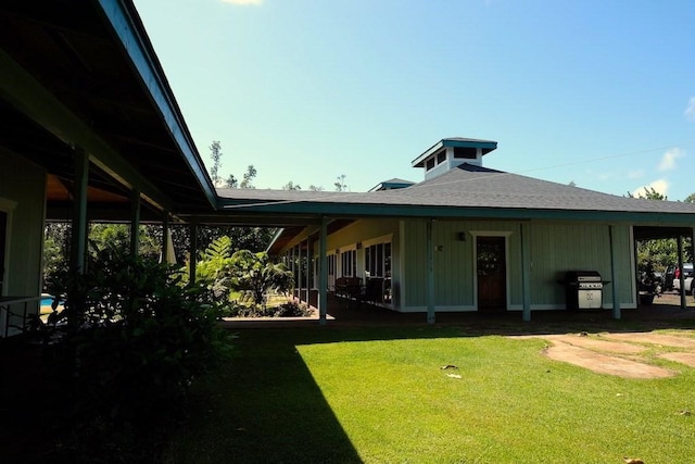 15-1050 Kiawe Rd, Keaau, HI 96749 - back of property with a yard and roof with shingles