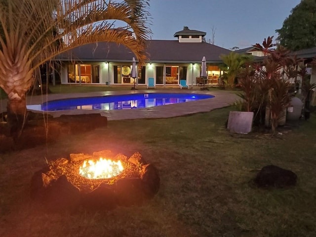 15-1050 Kiawe Rd, Keaau, HI 96749 - outdoor pool featuring a patio, a fire pit, and a lawn