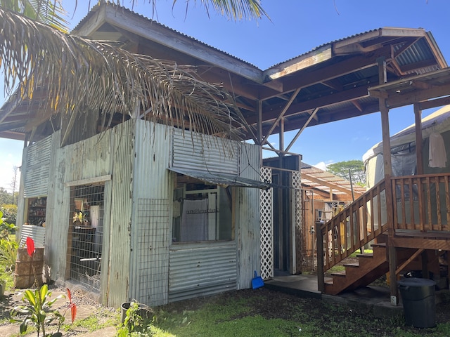 15-1843 11th Ave, Keaau, HI 96749 - view of side of property featuring stairs and metal roof
