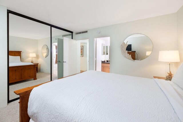 75-6106 Alii Dr Unit 311, Kailua-Kona, HI 96740 - bedroom with light carpet and ensuite bath