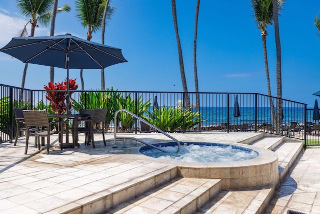 75-6106 Alii Dr Unit 311, Kailua-Kona, HI 96740 - view of pool with an in-ground hot tub, a patio, a water view, and outdoor dining area