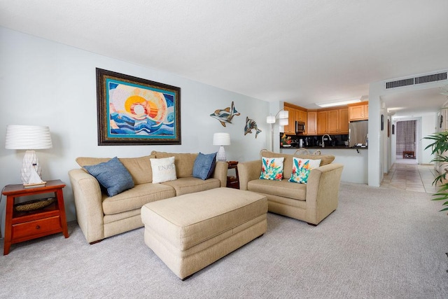 75-6106 Alii Dr Unit 311, Kailua-Kona, HI 96740 - living room with light colored carpet