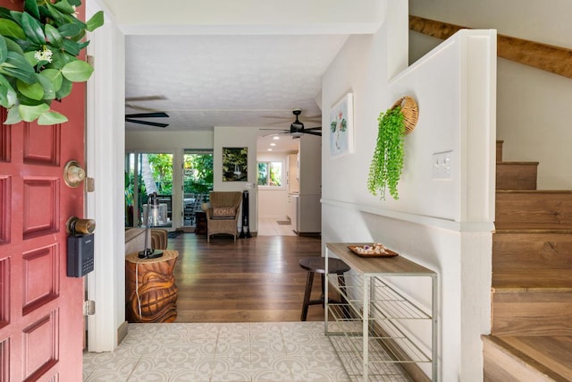 78-6800 Alii Dr Unit 20, Kailua-Kona, HI 96740 - foyer with a ceiling fan, stairs, and wood finished floors