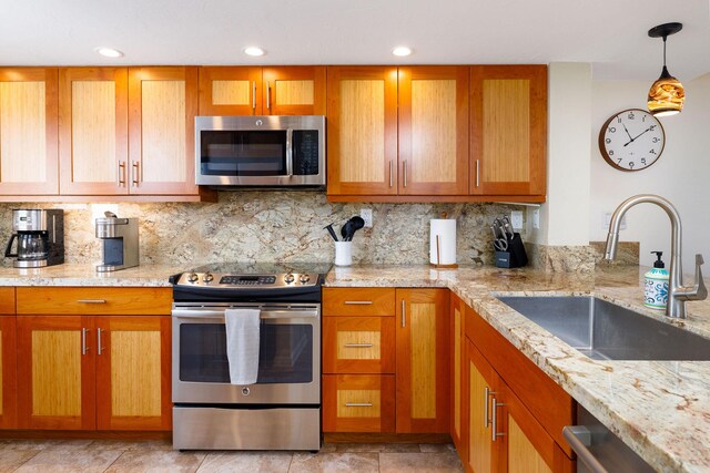 76-6225 Alii Dr Unit 105, Kailua-Kona, HI 96740 - kitchen with appliances with stainless steel finishes, a sink, light stone countertops, and recessed lighting
