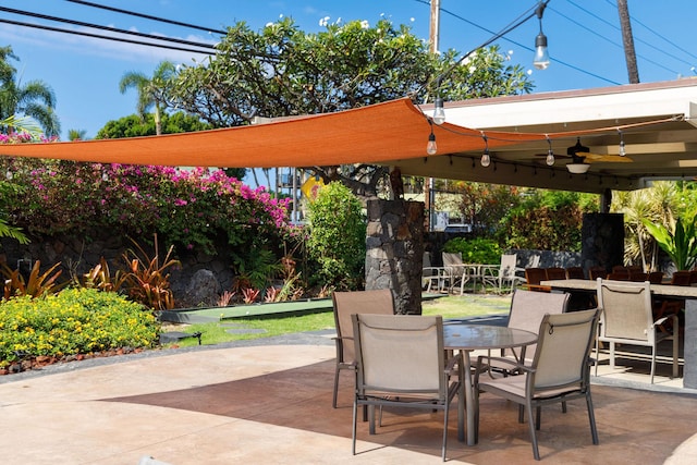 76-6225 Alii Dr Unit 105, Kailua-Kona, HI 96740 - view of patio with outdoor dining space and ceiling fan