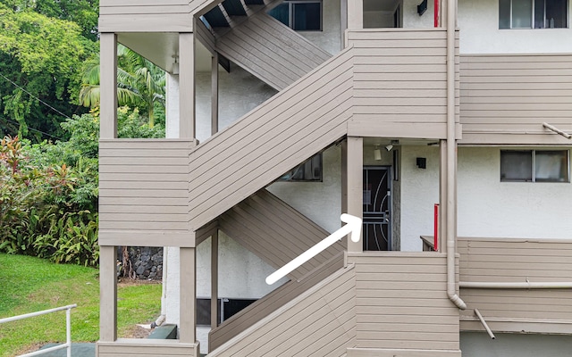 360 Kauila St Unit 201, Hilo, HI 96720 - view of home's exterior featuring stucco siding and a yard