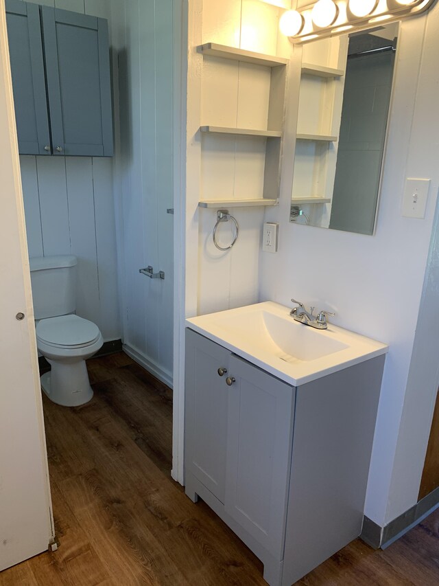 307 Lehua St Unit 22, Hilo, HI 96720 - bathroom featuring toilet, wood finished floors, and vanity