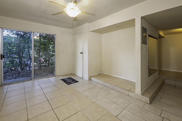 75-156 Lunapule Rd, Kailua-Kona, HI 96740 - spare room with light tile patterned floors, a ceiling fan, electric panel, and baseboards