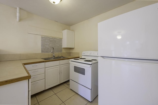 75-156 Lunapule Rd, Kailua-Kona, HI 96740 - kitchen with white appliances, a sink, white cabinets, and light tile patterned flooring