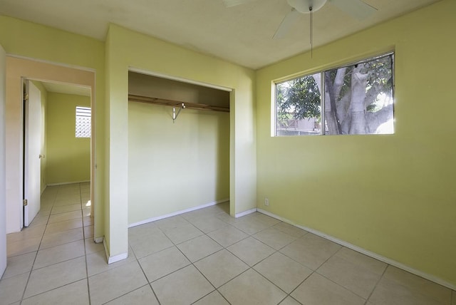 75-156 Lunapule Rd, Kailua-Kona, HI 96740 - unfurnished bedroom featuring light tile patterned floors, a closet, and baseboards