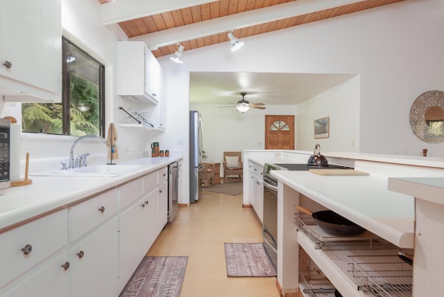 13-3638 Kumakahi St, Pahoa, HI 96778 - kitchen featuring appliances with stainless steel finishes, light floors, wooden ceiling, light countertops, and white cabinets