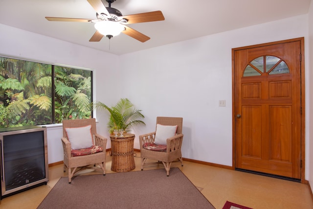 13-3638 Kumakahi St, Pahoa, HI 96778 - sitting room featuring beverage cooler, baseboards, light floors, and a ceiling fan