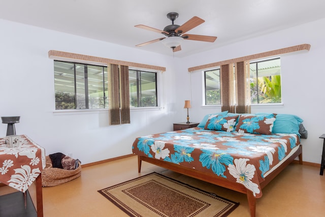13-3638 Kumakahi St, Pahoa, HI 96778 - bedroom featuring multiple windows, baseboards, and ceiling fan