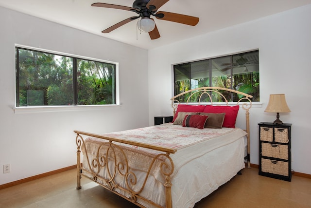 13-3638 Kumakahi St, Pahoa, HI 96778 - bedroom featuring multiple windows, baseboards, a ceiling fan, and tile patterned floors