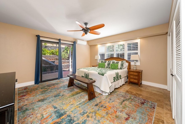 78-6881 Keaupuni St, Kailua-Kona, HI 96740 - bedroom featuring baseboards, access to exterior, a wall unit AC, and a ceiling fan
