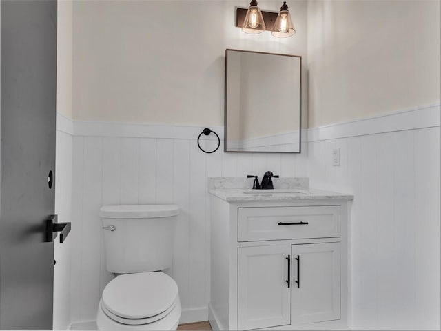 1261-B Haihai St, Hilo, HI 96720 - half bath with wainscoting, vanity, and toilet
