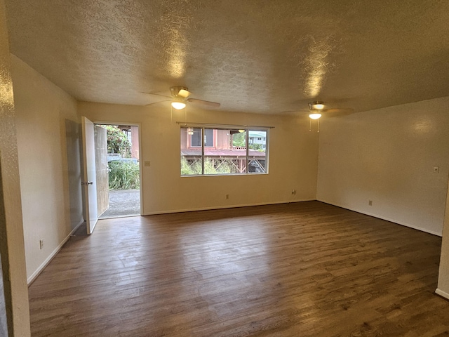 37-A Noio Ln Unit 2, Hilo, HI 96720 - spare room featuring a ceiling fan, dark wood-style floors, a textured ceiling, and baseboards