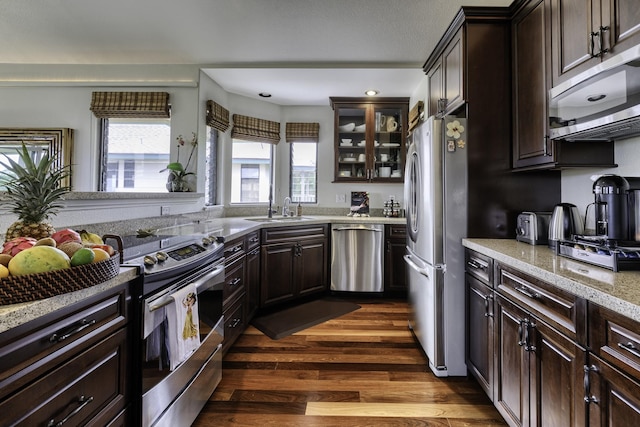 5451 Ka Haku Rd Unit 8, Princeville, HI 96722 - kitchen with appliances with stainless steel finishes, a sink, dark brown cabinetry, dark wood-type flooring, and recessed lighting