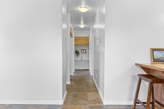 12-7046 Kehauopuna St, Pahoa, HI 96778 - corridor with stone tile flooring and baseboards
