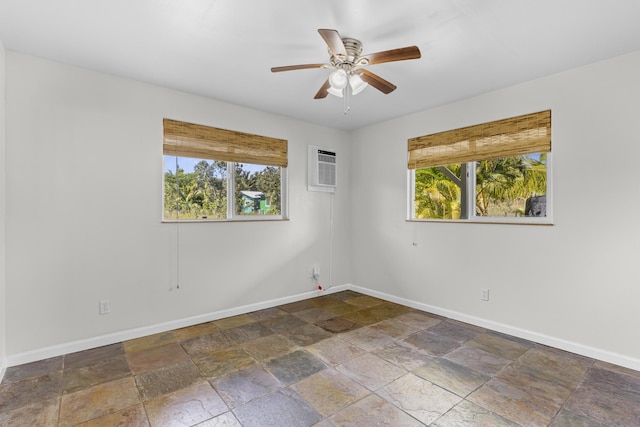 12-7046 Kehauopuna St, Pahoa, HI 96778 - empty room with plenty of natural light, stone tile flooring, and baseboards