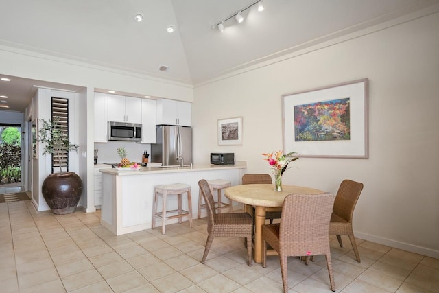 2253 Poipu Rd Unit 2, Koloa, HI 96756 - dining area featuring baseboards, high vaulted ceiling, light tile patterned floors, track lighting, and recessed lighting