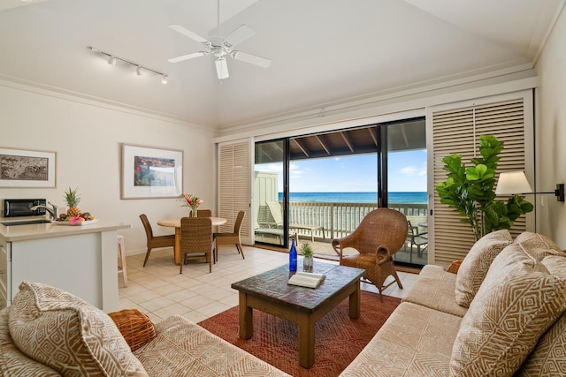 2253 Poipu Rd Unit 2, Koloa, HI 96756 - living room with rail lighting, vaulted ceiling, a water view, ceiling fan, and baseboards