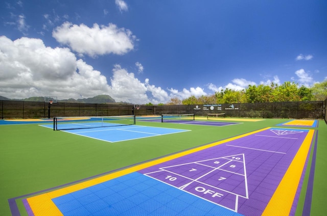 2253 Poipu Rd Unit 2, Koloa, HI 96756 - view of home's community with a tennis court and a mountain view