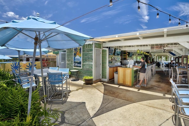2253 Poipu Rd Unit 2, Koloa, HI 96756 - view of patio featuring outdoor dining space and exterior bar